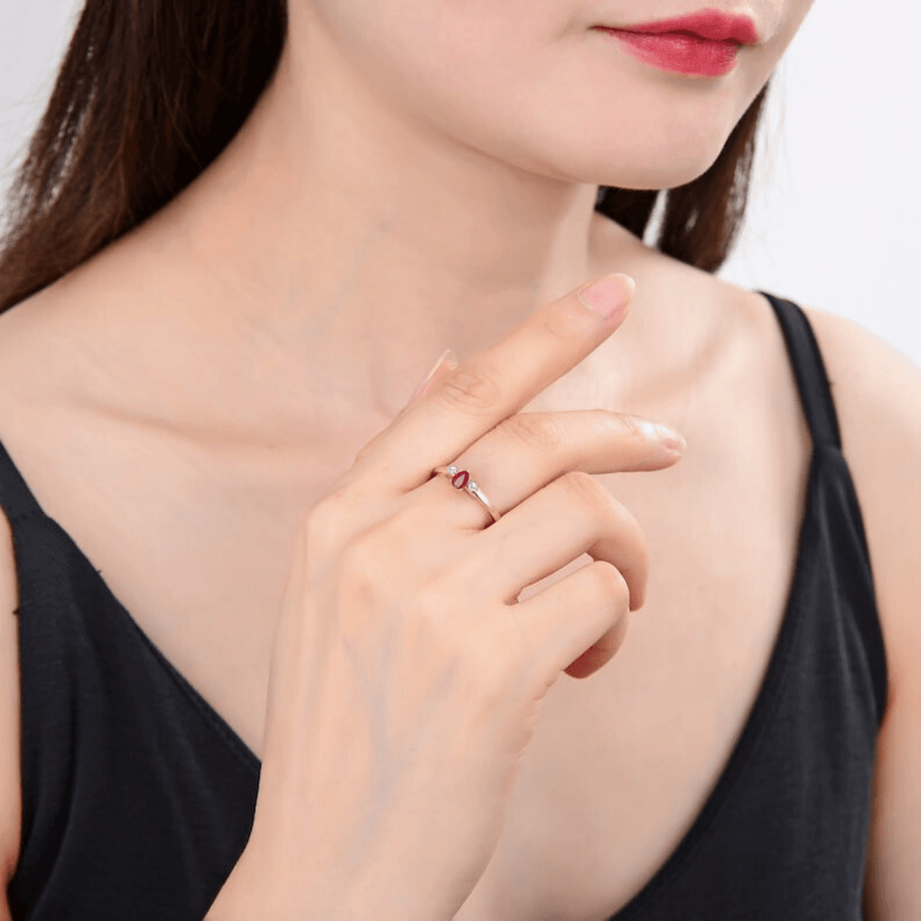 Ruby and rose gold ring on model, model in natural ruby ring, three stone ring design,model in red gemstone