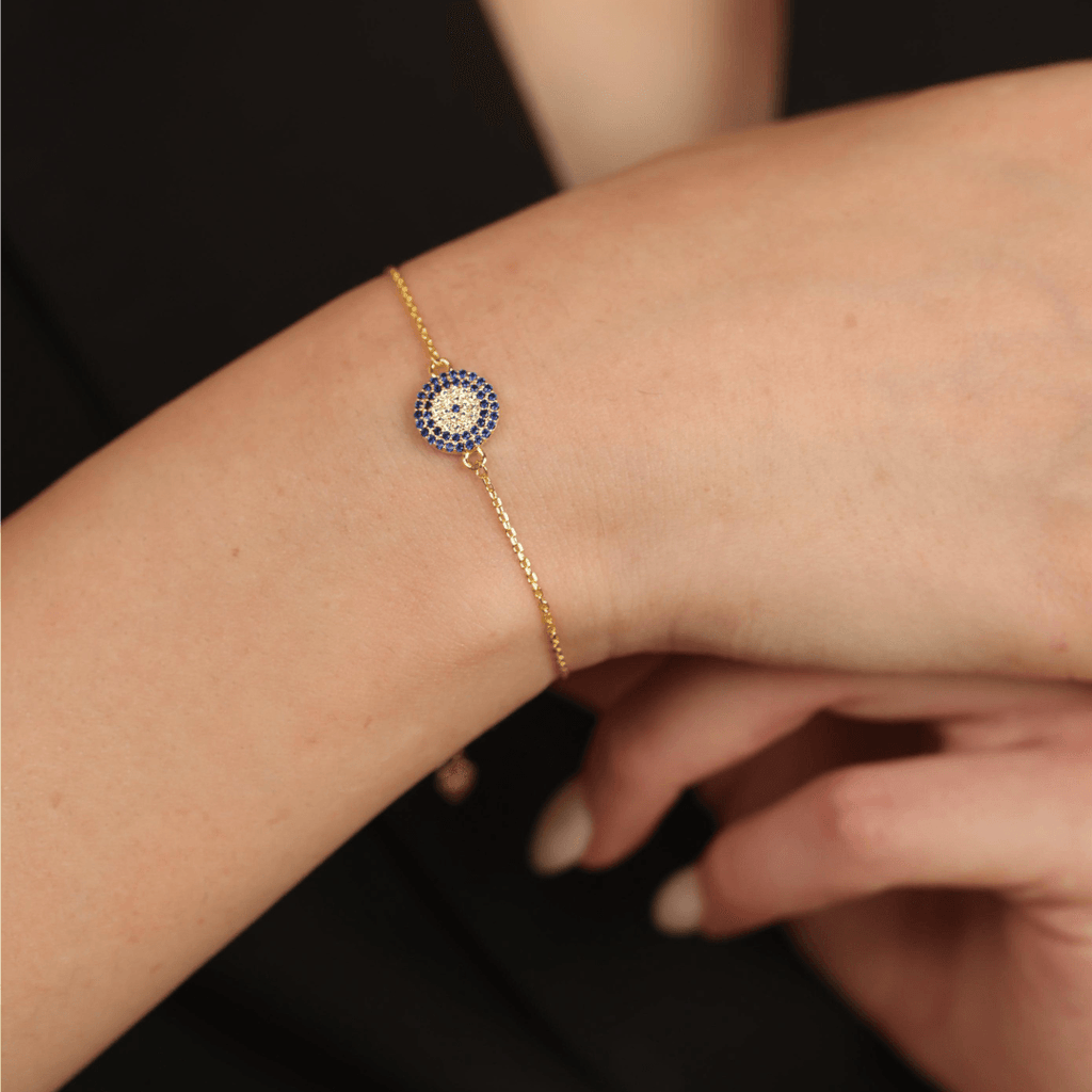 Elegant model hand showcasing the intricate details of ourEvil Eye Bracelet Gold Plated Silver Evil Eye Blue Sapphire Protection Bracelet Evil Eye Guardian Bracelet for Women Birthday Gift for Her