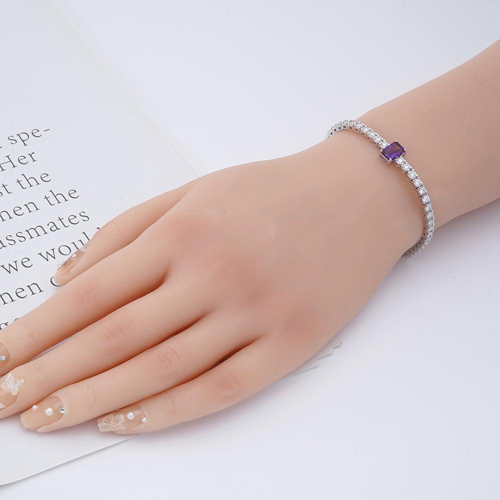 Elegant model hand showcasing the intricate details of our silver bracelet Natural Octagoan Dark Amethyst Bracelet - FineColorJewels