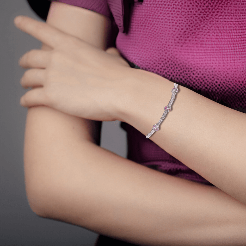 Elegant model hand showcasing the intricate details of our Tennis Bracelet Pink Gemstone Bracelet for Women September Birthstone Dainty Bracelet