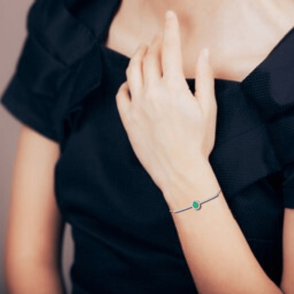 Elegant model hand showcasing the intricate details of our Natural Emerald Solitaire Bracelet 925 Sterling Silver Bracelet Green Bracelet Oval Emerald Bracelet for Women 