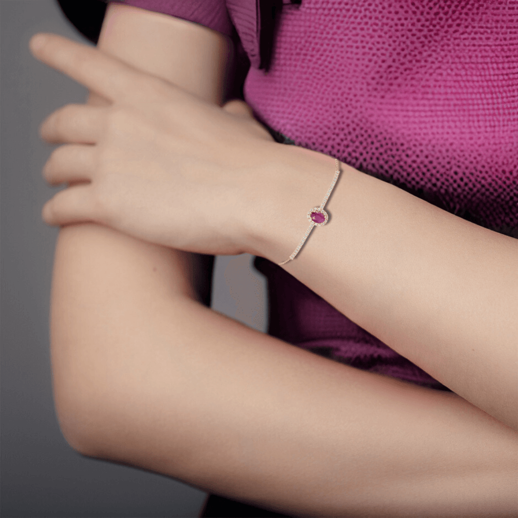 Elegant model hand showcasing the intricate details of our Natural Ruby Solitaire Bracelet Yellow Gold Plated Oval Ruby Bracelet July Birthday Gift Bridesmaid Gift 