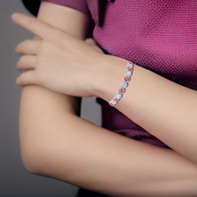 Load image into Gallery viewer, adjustable bracelet on model, woman wearing bracelet, sapphire bracelet on woman, model wearing sapphire jewelry