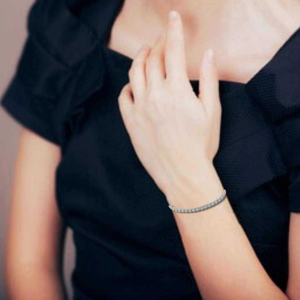 Elegant model hand showcasing the intricate details of our silver bracelet,White Rhodium Plated Sterling Silver Adjustable Chain Tennis Moissanite Bracelet