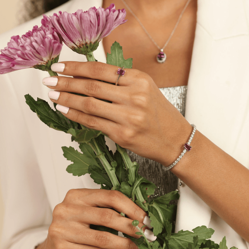 Elegant model hand showcasing the intricate details of our Natural Dark Amethyst Bracelet With Moissanite Accents Octagon Amethyst Statement Adjustable Bracelet silver bracelet