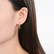 Load image into Gallery viewer, model showcasing Natural Peridot Green Peridot Dangling Rhodium Plated Silver Earrings Gift 