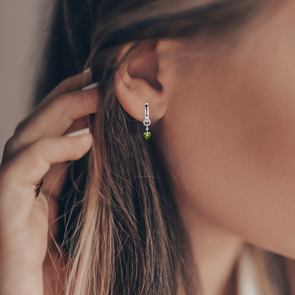 model showcasing Evil Eye Earrings Dangle Earrings Evil Eye Peridot Earrings with Natural Peridot Green Peridot Dangling Rhodium Plated Silver Earrings