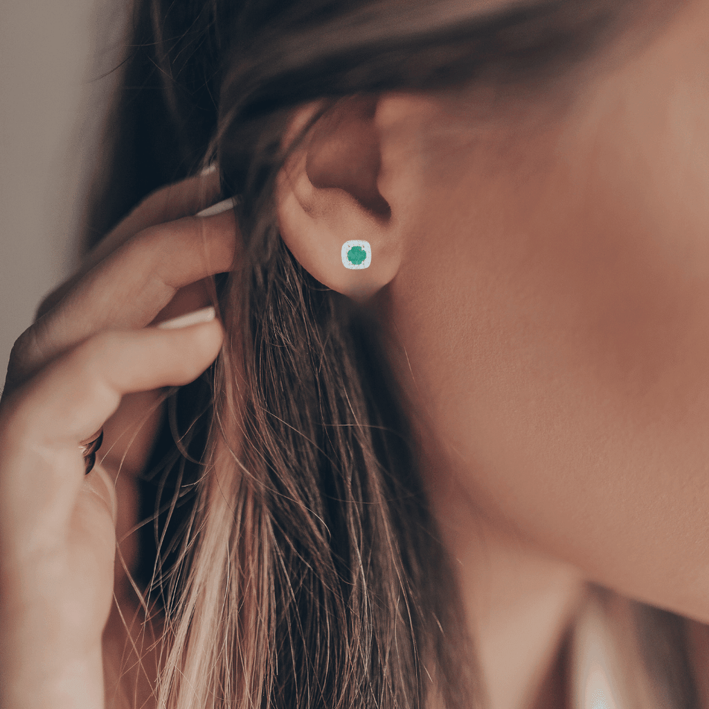 Model showcasing gemstone earrings	emerald earrings	moissanite accents	silver earrings	green earrings	genuine emerald	halo earrings	affordable jewelry	gift ideas for her	birthstone jewelry	birthstone earring stud earrings	silver stud