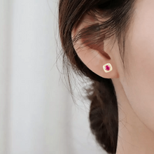 Load image into Gallery viewer, model showcasing Genuine Ruby Halo Earrings with Moissanite Accents Gold Plated Silver Stud Earrings 