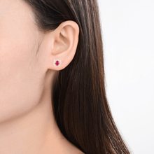 Load image into Gallery viewer, Model showcasing Genuine Ruby Halo Earrings with Moissanite Accents Gold Plated Silver Stud Earrings