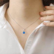 Load image into Gallery viewer, model showcasing  Lab Grown Blue Opal Teardrop Pendant with CZ Accents October Birthstone Gift Blue Pendant Anniversary Gift