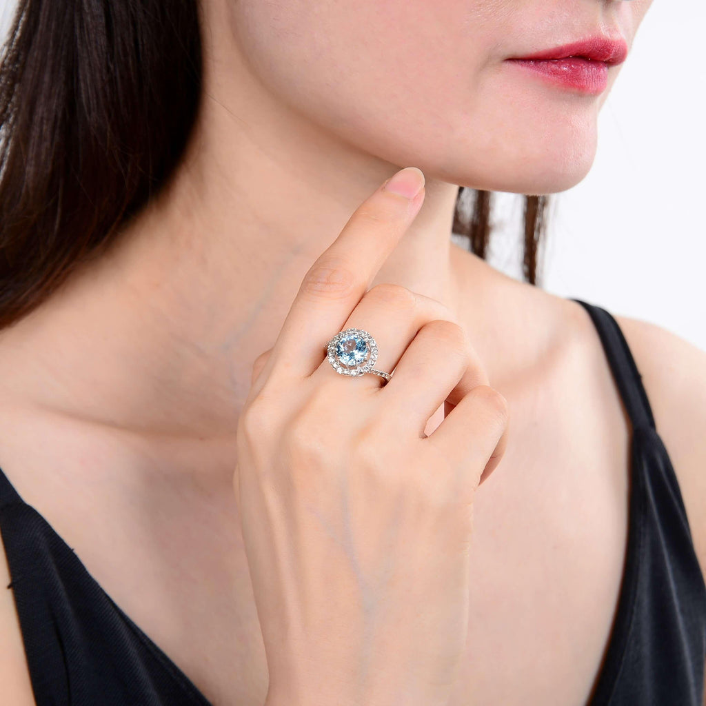 Signature Round Blue Topaz Ring .
$ 50 – 100, 6, 7, Blue, Round, Blue Topaz, White Topaz, 925 Sterling Silver, Halo