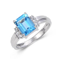 Load image into Gallery viewer, Octagon Emerald Cut ring Accented with White Topaz on a model hand  925 sterling silver