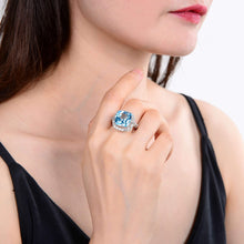 Load image into Gallery viewer, Sterling Silver Cushion Blue Topaz Ring, Accented with White Topaz.
$ 150 – 200, 7, Blue, Emerald Cut, Blue Topaz, White Topaz, 925 Sterling Silver, Statement